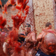 Image for article titled Photos: Spaniards mark another year by gleefully smashing each other in the face with tomatoes